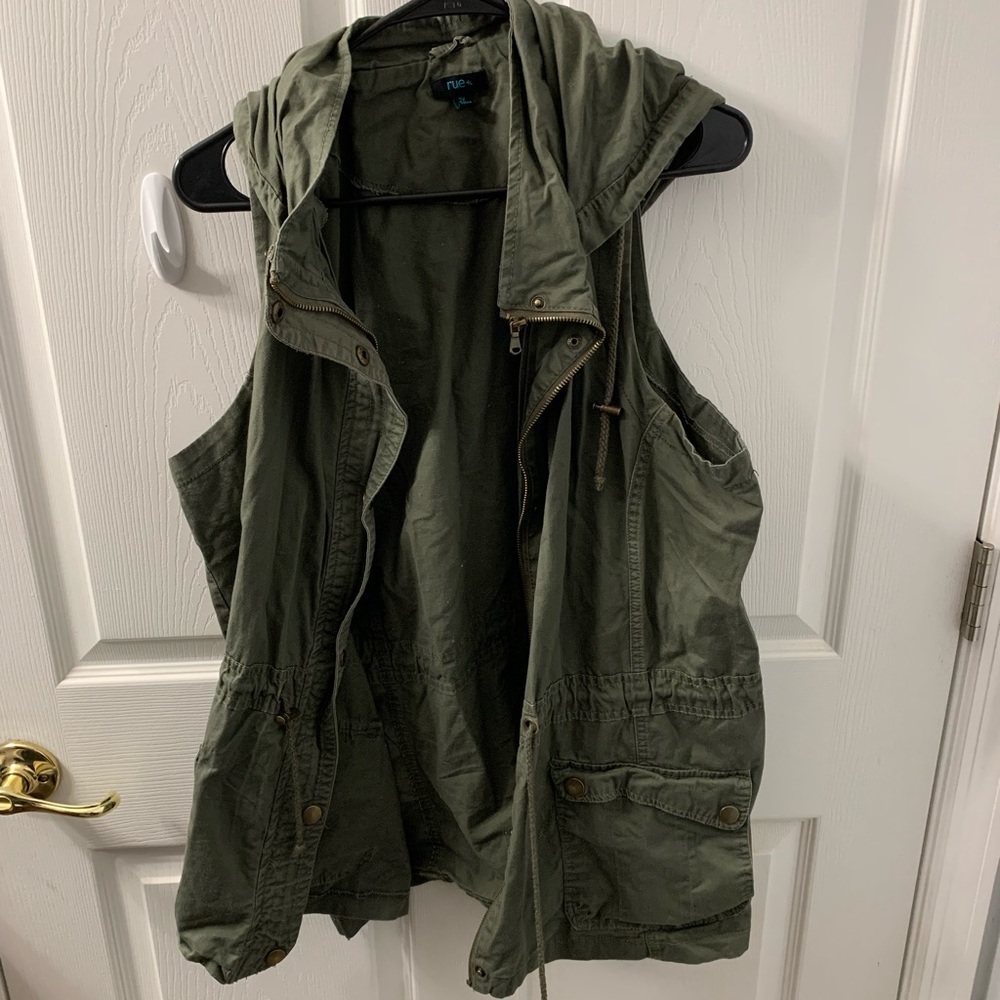 Green denim material vest.